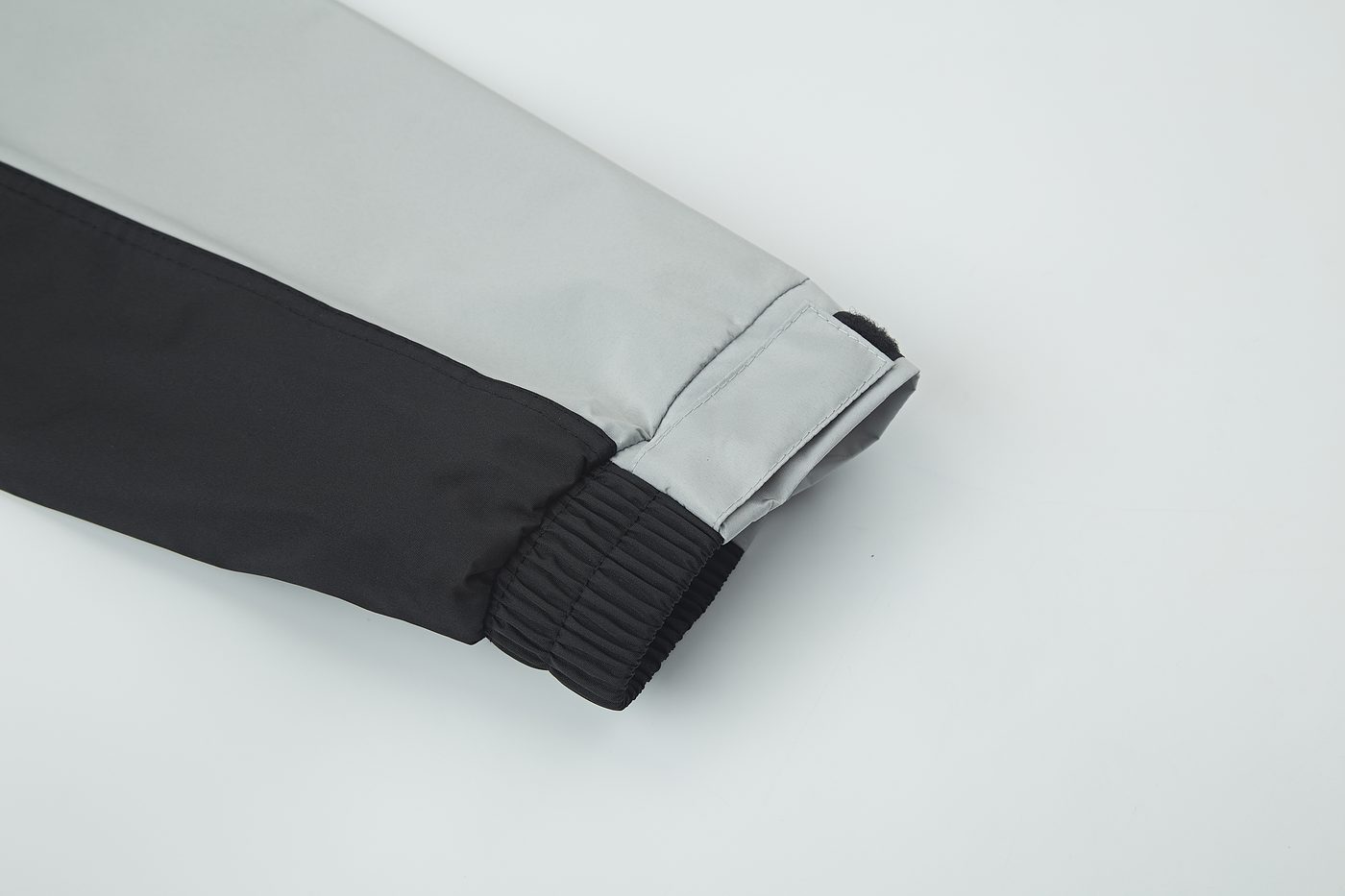 Sleeve cuff with elastic gather and hook-and-loop tab — Grey