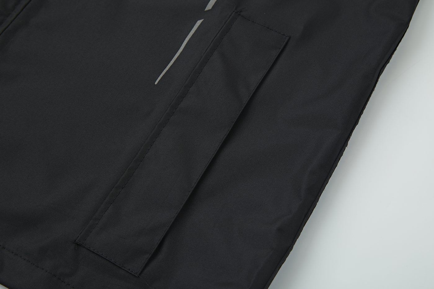 Slanted chest pocket with reflective line accent