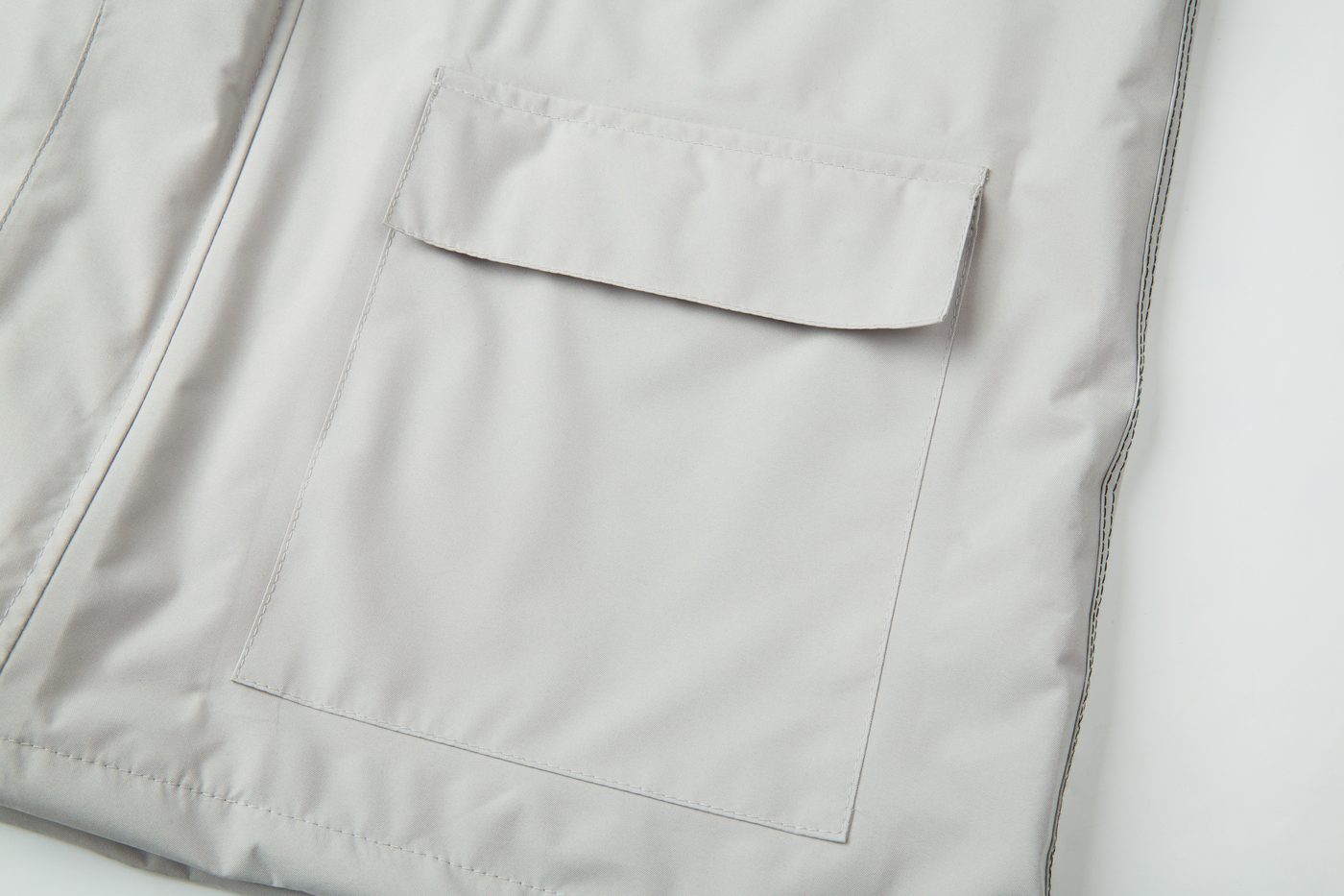 Flap pocket on the grey body panel