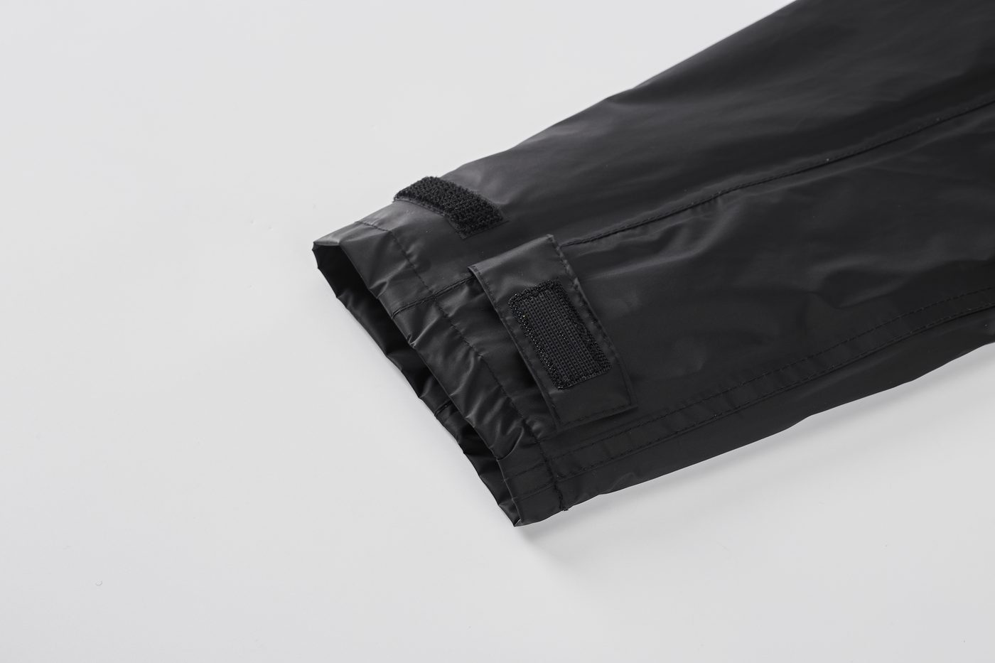 Sleeve cuff with double hook-and-loop adjustment strap