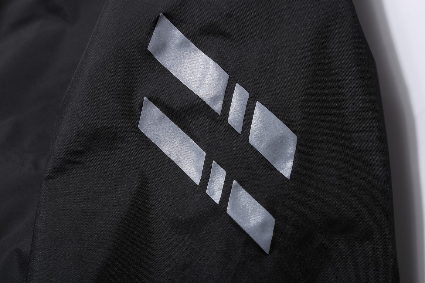 Double diagonal reflective prints on sleeve — macro